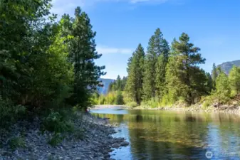 The private riverfront offers a quiet place to swim, fish, launch your paddle board or simply relax by the shore.