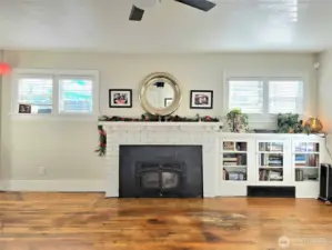 Wood stove and built ins with lots of windows. Great light!