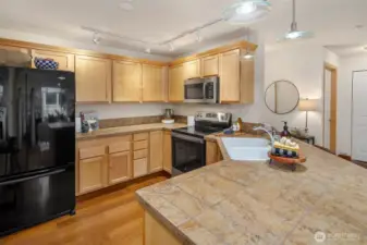 Open kitchen with abundant cabinets - plenty of workspace