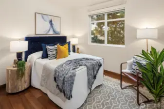 The cozy second bedroom is on the opposite side of the condo from the primary