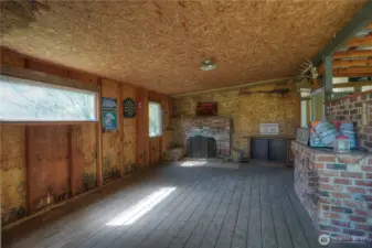 Cozy fireplace game room offering the perfect space for relaxing and gathering. Ideal as a family retreat area for entertainment, games, or unwinding in a warm, inviting setting.