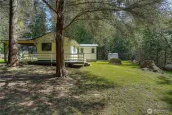 , Wooded setting with its own sense of privacy and space. Ideal for guests, extended living, or potential rental opportunity.
