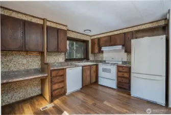 Spacious kitchen with plenty of storage space, offering a functional layout for everyday living. Ample cabinetry and counter space provide convenience and efficiency for cooking and entertaining.