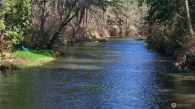 Peaceful river frontage with your own private spot to relax, unwind, and enjoy the soothing sounds of the water, perfect for quiet mornings, fishing, or simply taking in the natural beauty.