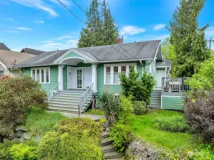 Welcome to Phinney Ridge! This 1918 house sits high on the block at the corner of Greenwood Ave and N 64th Street. It's a short walk to Woodland Park and walking distance to Green Lake or Ballard.