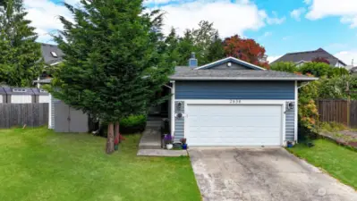 Welcome home! Two car attached garage plus long drive with plenty of parking space.