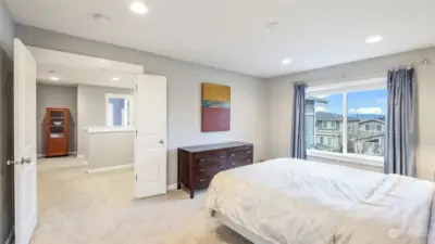 This view of the bedroom highlights its convenient accessibility to other areas of the home.