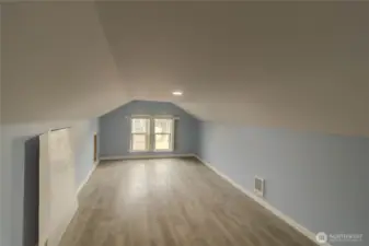 Upstairs workspace can be used as extra bedroom or for business storage
