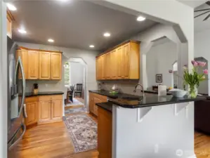 Across from the kitchen is a separate dining room. Bring a couple of stools to the kitchen bar for casual dining and conversation.