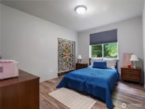 One of the three bedrooms located on the main floor. All with 9 foot ceilings, great neutral wall color, large windows, and either luxury laminate flooring or wall to wall carpet.