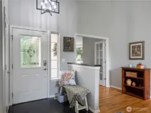 Great entryway to the home. Through the French doors is a den/office space. Original hardwood floors - the seller is offering a $10,000 credit, with a full priced offer, to have the floors refinished.