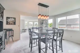 This spacious dining room features an open-concept layout.