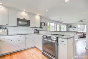 This beautifully updated kitchen is a bright and functional centerpiece of the home.