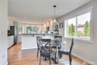 Eating area off of kitchen over looks the back yard.