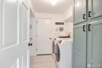 Laundry room with extra storage.
