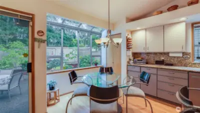 The eating nook is the perfect spot to enjoy the serene private views from inside and outside of this home.  Plenty of storage and a pantry.  The eat nook has a perfect window wall with peaceful views into the backyard.
