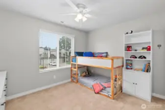 1 of 2 additional bedrooms with ceiling fans.