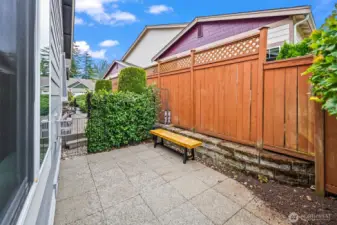 Side patio is a nice place to absorb sunshine and also maintain privacy.