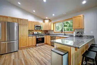 Chefs kitchen boasting custom cabinetry & stylish finishes~
