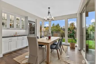 BUILT-IN ENTERTAINING TO THE MAX-FEATURING SUB-ZERO WINE/BEVERAGE FRIDGE + LIT CABINETRY