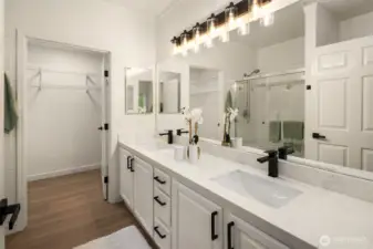 Updated with new floors, new countertops, hardware and lighting. Plenty of space for cosmetics and more.