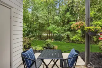 Adorable patio overlooking the HOA maintained green space. Room for pots and hanging baskets to complete the European al fresco look.