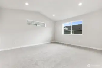 Primary Bedroom with Vaulted Ceilings. Home Under Construction - Photos are not of actual home. Colors and finishes may vary. Photos may contain upgrades