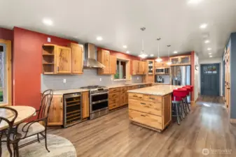 Wine refrigerator and double ovens complete this stunning kitchen.