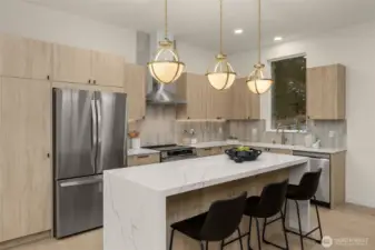 Beautiful quartz waterfall kitchen island.