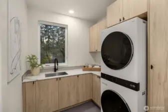 Convenient upper level laundry room.
