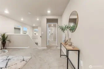 View towards the stairs to the left, and the primary suite entrance to the right.