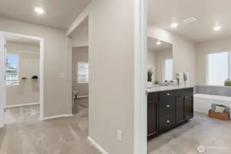 As you enter the primary suite, the ensuite bath is on your right.