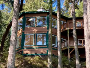 Large picture windows adorn all angles of this contemporary NorthWest waterfront retreat