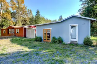 The red home is the main home on the property while the blue home is the additional dwelling.