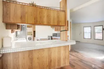 Open concept floor plan shown here from the dining room overlooking the kitchen and living room.