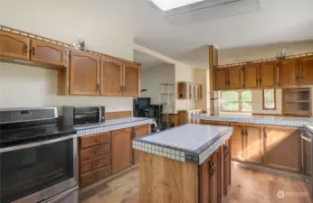 This is the view from the fridge area towards the living room, dining room, and large family room.