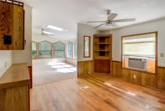 The spacious dining room between the living room and family with lots of storage and display shelves.