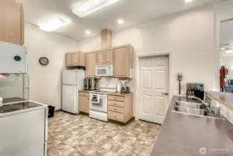 The community center kitchen is designed to be the heart of social gatherings and shared activities.
