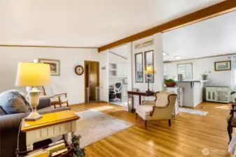 Beautiful vinyl laminate flooring, spacious living room flows into the dining room and kitchen.