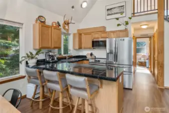 This kitchen has stainless steel appliances, granite countertops with cabinets that encourage display high above.  You could showcase those collectables you have stored in boxes right here in this space.