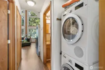 Laundry center located away from the main living space of the house.