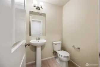 1/2 Bath on Main-Disclaimer:  Photos are from another Rose floor plan in previous community, finishes, upgrades, and features will vary.