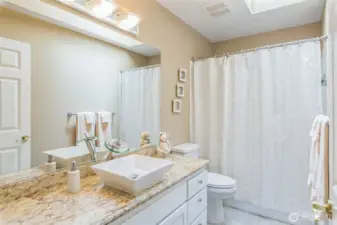 The main bath serving the three guest rooms upstairs.