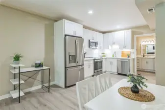 Downstairs is the true bonus space!  Imagine having a completely separate space for multi-generational living or as an income producing rental.  All new - flooring, cabinets, appliances, dining set.  Everything is included in the sale....right down to the flatware and dishes.