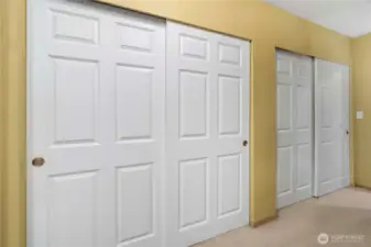 Two sets of closets as you enter primary suite