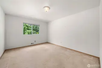 One of two additional rooms on upper level--office/entertainment/bedroom