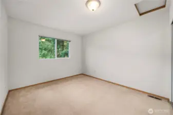 One of two additional bedrooms on upper level