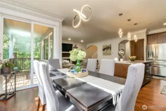 Dinning Room off kitchen leads to covered deck & hot tub area on concrete patio.