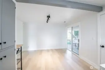 Dining room just off kitchen (open flow from kitchen to dining). Sliding glass door on the right of this photo to covered concred patio & back yard.
