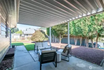 Covered patio off Large Kitchen, to easily access patio & backyard. Fully Fenced (front, back, sides).